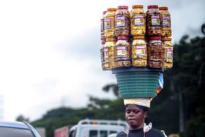 free-photo-of-a-woman-with-a-basket-of-food-on-her-head